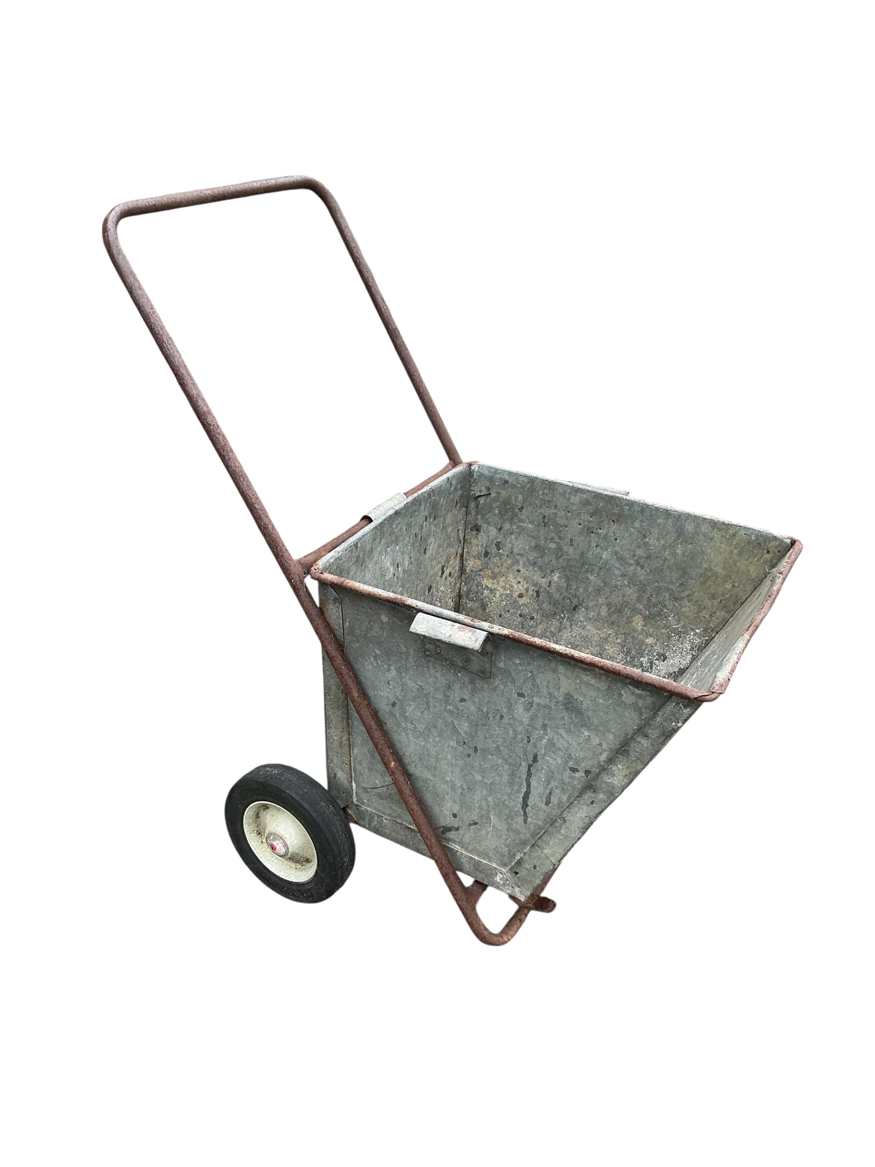 A vintage galvanised garden wheelbarrow, height 91cm